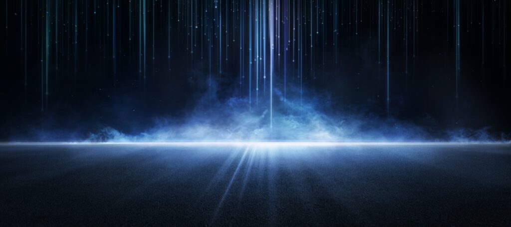 Light blue rays coming down from above against black background representing energy in motion